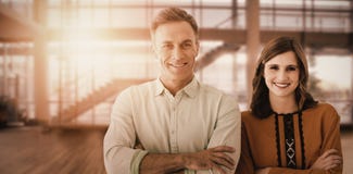 Composite image of portrait of couple with crossed arms royalty free stock image Composite image of portrait of couple with crossed arms royalty free stock image