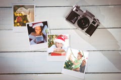 Composite image of pretty brunette in santa outfit opening gift Royalty Free Stock Images Composite image of pretty brunette in santa outfit opening gift Royalty Free Stock Images