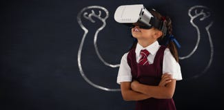 Composite image of schoolgirl wearing virtual reality headset enjoying with arms crossed Royalty Free Stock Image Composite image of schoolgirl wearing virtual reality headset enjoying with arms crossed Royalty Free Stock Image