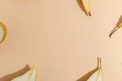 Composition of cut pears on a beige background. Top view royalty free stock image Composition of cut pears on a beige background. Top view royalty free stock image