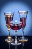Composition of glass goblets on a colored background stock images Composition of glass goblets on a colored background stock images
