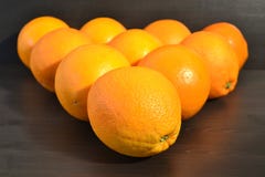 Composition of a group of ripe oranges in a shape of a triangle. stock images Composition of a group of ripe oranges in a shape of a triangle. stock images