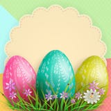 Composition With A Curly Round Frame, Three Easter Eggs And Grass With Flowers, Royalty Free Stock Photos