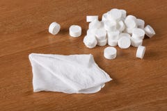 Compressed coin tissues and spreaded out tissue Stock Image Compressed coin tissues and spreaded out tissue Stock Image