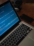 Computer code on laptop web developing and mobile phone stock image Computer code on laptop web developing and mobile phone stock image