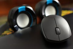 Computer mouse on the background of the speakers stock images Computer mouse on the background of the speakers stock images