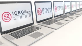 Computer portatili moderni con l'industriale e Commercial Bank del logo della Cina ICBC Editoriale concettuale 3D di tecnologie i royalty illustrazione gratis Computer portatili moderni con l'industriale e Commercial Bank del logo della Cina ICBC Editoriale concettuale 3D di tecnologie i royalty illustrazione gratis