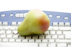 Computers Keyboard With Pear Royalty Free Stock Photo