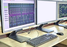 Computers and monitors with schematic diagram for supervisory, control and data acquisition stock image Computers and monitors with schematic diagram for supervisory, control and data acquisition stock image
