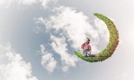 Concept of careless happy childhood with girl dreaming about som Stock Photos Concept of careless happy childhood with girl dreaming about som Stock Photos