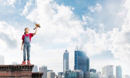 Concept of careless happy childhood with girl dreaming to become pilot stock images Concept of careless happy childhood with girl dreaming to become pilot stock images