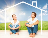 Concept: housing and mortgage for young families. couple dreaming of home