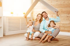 Concept housing a young family. mother father and children in n royalty free stock photography Concept housing a young family. mother father and children in n royalty free stock photography