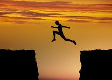 Courage and fitness concept with jump between rocks Royalty Free Stock Photos Courage and fitness concept with jump between rocks Royalty Free Stock Photos