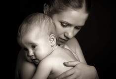 Concept for love and family. mother hugging baby tenderly in mon