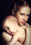 Concept for love and family. mother hugging baby tenderly in mon royalty free stock photography Concept for love and family. mother hugging baby tenderly in mon royalty free stock photography