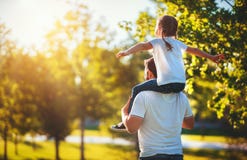 Concept Of Father`s Day! Happy Family Dad And Child Daughter Back In Nature Stock Images Concept Of Father`s Day! Happy Family Dad And Child Daughter Back In Nature Stock Images
