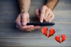 Conceptual image of man hands texting on mobile phone with digital generated red hearts royalty free stock images Conceptual image of man hands texting on mobile phone with digital generated red hearts royalty free stock images
