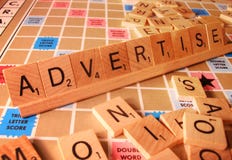 Concetto di affari - faccia pubblicità alla parola di Scrabble immagini stock Concetto di affari - faccia pubblicità alla parola di Scrabble immagini stock