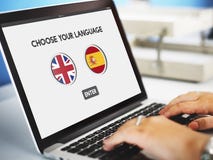 Concetto di inglese-spagnolo del dizionario di lingua fotografia stock Concetto di inglese-spagnolo del dizionario di lingua fotografia stock