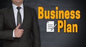 Concetto ed uomo d'affari del business plan con i pollici su fotografia stock libera da diritti Concetto ed uomo d'affari del business plan con i pollici su fotografia stock libera da diritti