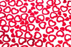 Confettis rouges de coeurs de modèle décoratif de jour du ` s de Valentine d'isolement sur le fond blanc image libre de droits Confettis rouges de coeurs de modèle décoratif de jour du ` s de Valentine d'isolement sur le fond blanc image libre de droits