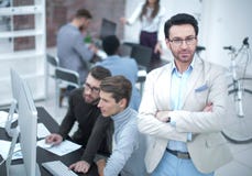 Confident businessman on the background of the office. stock photo Confident businessman on the background of the office. stock photo