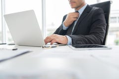 Confident Businessman is working on Laptop computer. stock photos Confident Businessman is working on Laptop computer. stock photos