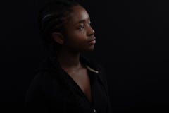 Confident and happy Black Female Model Looking Away Against Black Background stock images Confident and happy Black Female Model Looking Away Against Black Background stock images