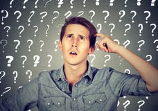 Confused man has too many questions and no answer royalty free stock photo Confused man has too many questions and no answer royalty free stock photo