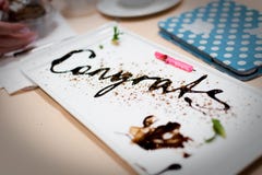 Congratulations Message Written In Chocolate At An Anniversary Party. Stock Images Congratulations Message Written In Chocolate At An Anniversary Party. Stock Images
