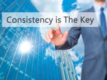 Consistency is The Key - Businessman hand touch button on virtu stock photo Consistency is The Key - Businessman hand touch button on virtu stock photo