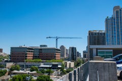 Construction Crane over horizon with traffic heading towards Austin Downtown stock images Construction Crane over horizon with traffic heading towards Austin Downtown stock images