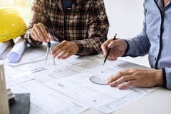 Construction engineering or architect discuss a blueprint while royalty free stock images Construction engineering or architect discuss a blueprint while royalty free stock images