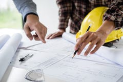 Construction engineering or architect discuss a blueprint while checking information on drawing and sketching meeting for royalty free stock photos Construction engineering or architect discuss a blueprint while checking information on drawing and sketching meeting for royalty free stock photos