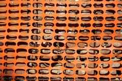 Construction safety fence, orange net around building site stock photo Construction safety fence, orange net around building site stock photo