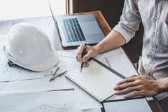 Construction and structure concept of engineer or architect working on blueprint, Engineer working with engineering tools for stock image Construction and structure concept of engineer or architect working on blueprint, Engineer working with engineering tools for stock image