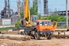 Construction work on pipe laying of pipeline into trench using a royalty free stock photos Construction work on pipe laying of pipeline into trench using a royalty free stock photos