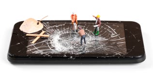 Construction worker figurines repairing broken smartphone screen royalty free stock photo Construction worker figurines repairing broken smartphone screen royalty free stock photo