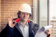 A construction worker gives you the okay sign, signaling that everything is a-okay. Soft focus, toned. royalty free stock photos A construction worker gives you the okay sign, signaling that everything is a-okay. Soft focus, toned. royalty free stock photos