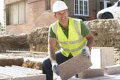 Construction Worker Laying Blockwork