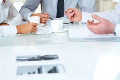 Consulting. Close-up of businesspeople discussing plan at meeting Consulting. Close-up of businesspeople discussing plan at meeting