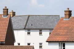 Contemporary Suburban Housing Estate. Modern White House With Slate Roof Tiles Stock Image