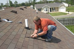 Contractor Repairing Roof