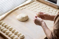 Cook Prepares Dumplings Royalty Free Stock Photography Cook Prepares Dumplings Royalty Free Stock Photography