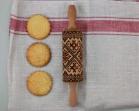 Cookies making concept, embossing roller, ready patterned shortbread, top view, royalty free stock photography Cookies making concept, embossing roller, ready patterned shortbread, top view, royalty free stock photography