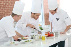 Cookin training with students in restaurant royalty free stock image Cookin training with students in restaurant royalty free stock image