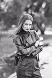 Cool girl in a black leather biker jacket walks around the city stock photo Cool girl in a black leather biker jacket walks around the city stock photo