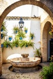 Cordoba: old typical street in the Juderia with plants and flowers. Andalucia, Spain stock photo Cordoba: old typical street in the Juderia with plants and flowers. Andalucia, Spain stock photo