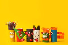 Coronavirus COVID-19 Disease 2020. Paper Toy Monsters For Halloween Party. Easy Crafts For Kids On Yellow Background, Child Art Stock Photo Coronavirus COVID-19 Disease 2020. Paper Toy Monsters For Halloween Party. Easy Crafts For Kids On Yellow Background, Child Art Stock Photo
